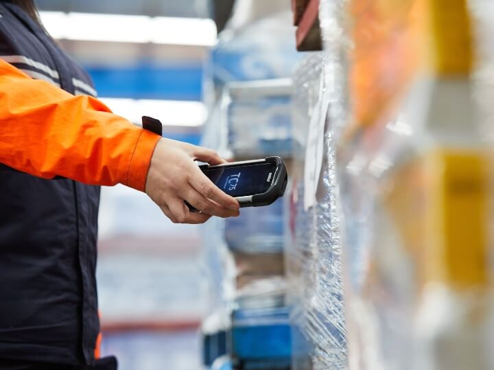 Chemcouriers Team Member scanning freight - Chemcouriers Team Member scanning freight